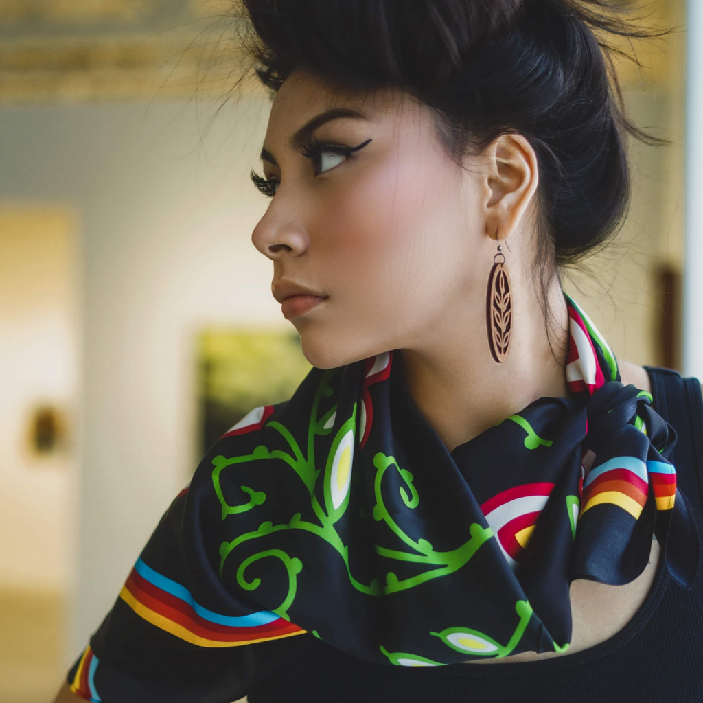 Woman looks to the left wearing Good Seed Earrings and Classic woodland scarf